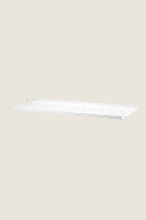 Bolina white powder-coated steel shelf with low edges and perforated surface for String System shelving units.