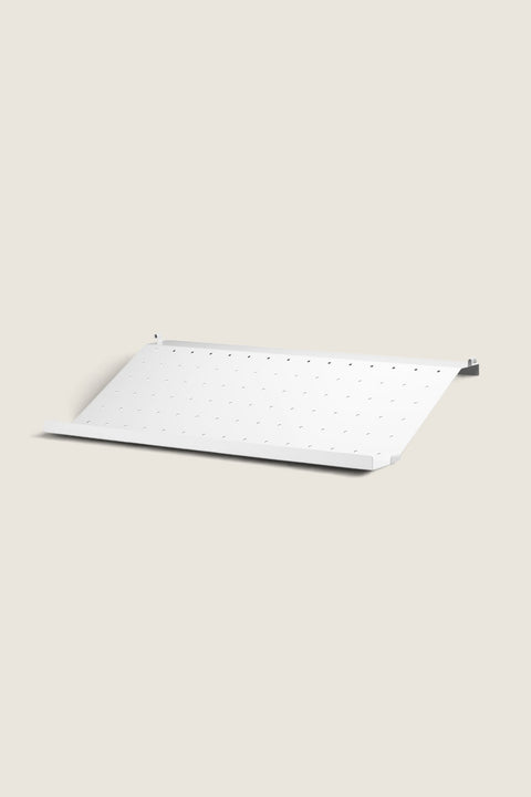 Bolina white metal shoe shelf for String System with perforated design, 58 cm wide for 30 cm deep wall panels.