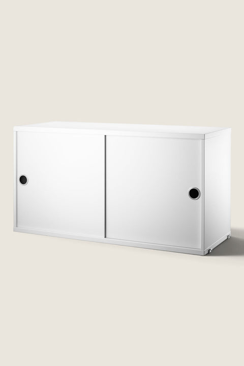 Bolina white String System cabinet with sliding doors and circular handles for modular wall shelving storage