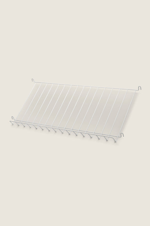 Bolina white powder-coated steel magazine shelf for String System, 78x30 cm wire rack for display.