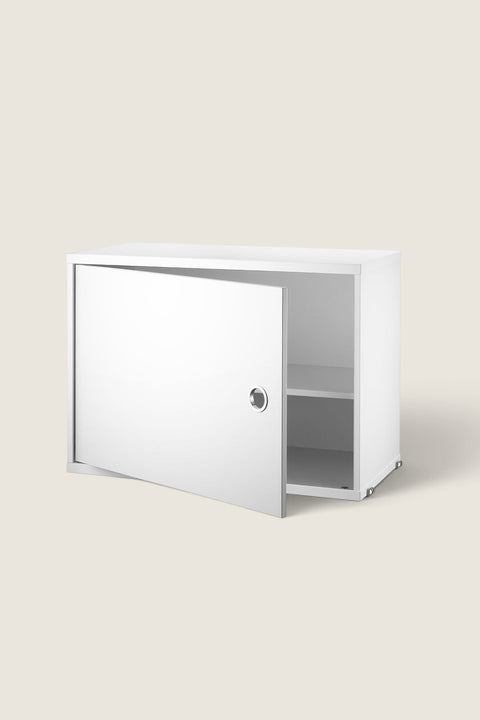 Bolina white lacquered MDF cabinet with a hinged door and adjustable interior shelf for the String System.