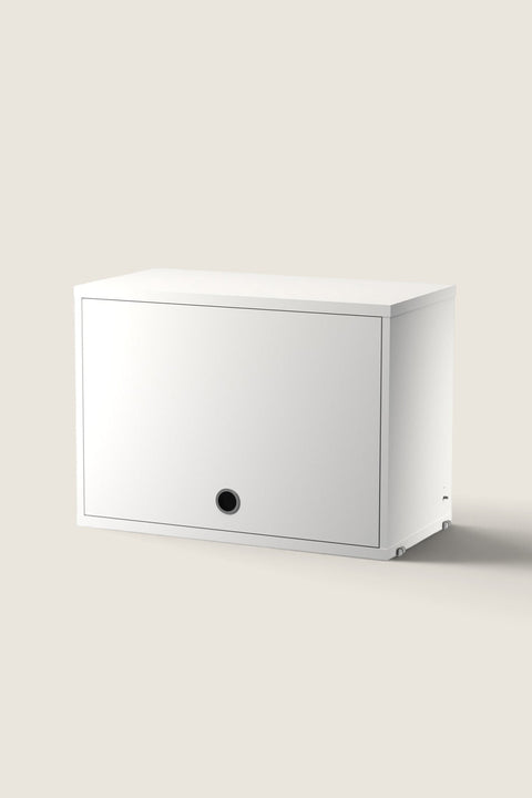 Bolina white String System flip door cabinet with a minimalist design and circular handle for wall-mounted storage.