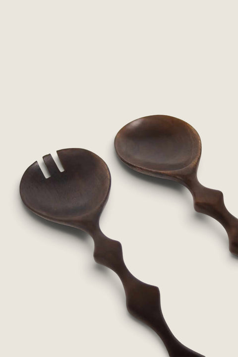 Bolina Zander dark brown mango wood salad servers with unique wavy handles and a burnt finish