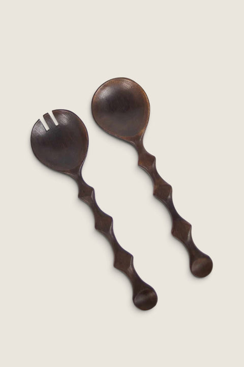 Bolina Zander dark brown mango wood salad servers with unique wavy handles and a burnt finish.