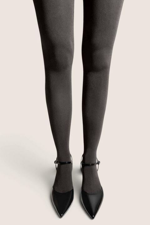 Bolina Velvet Silk 70 denier opaque tights in dark grey with a smooth, velvety finish worn with black pointed heels.