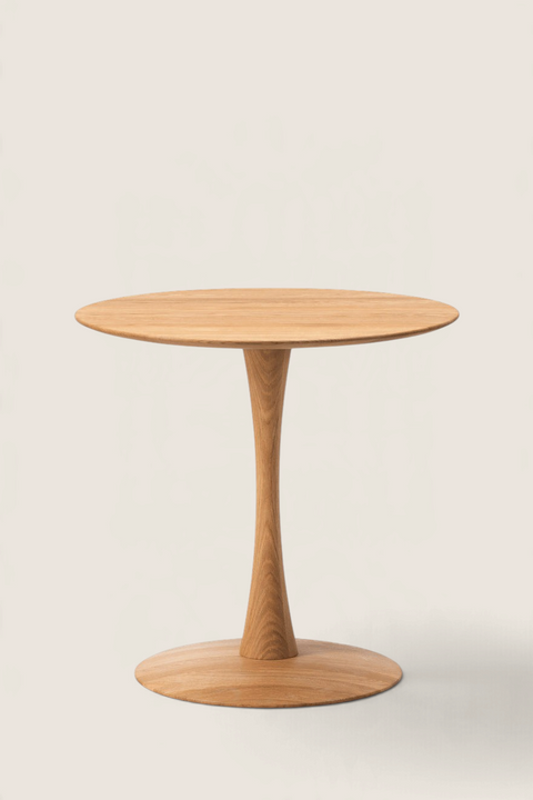 Bolina Trisse round dining table in oiled oak with a sculptural pedestal base, designed by Nanna Ditzel.