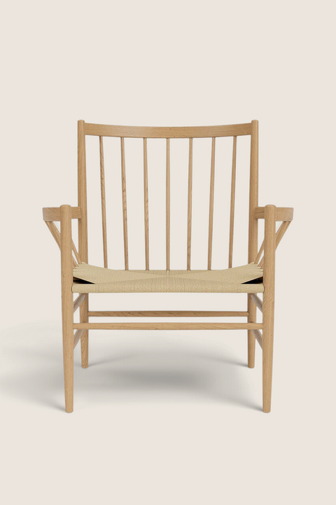 Bolina J82 lounge chair in lacquered oak with a woven paper cord seat and high spindle backrest