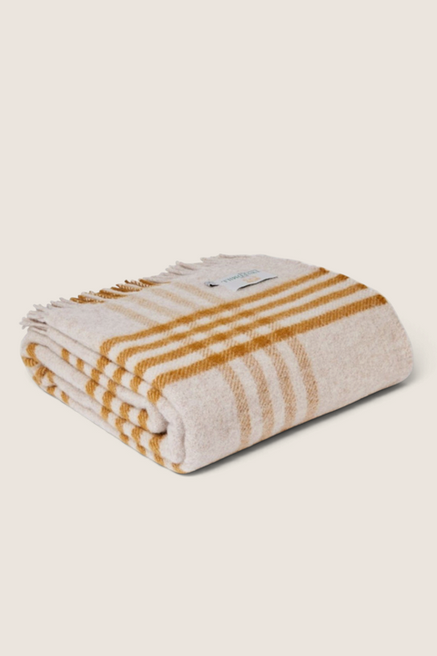 Bolina Tweedmill Hex Check wool throw in English mustard and vintage beige with a classic fringed edge