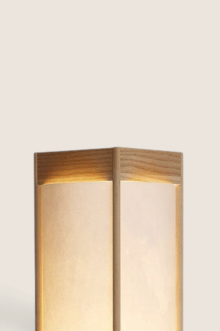 Bolina Andon table lamp in light ash wood with a matte finish and soft glowing paper shade, minimalist design.