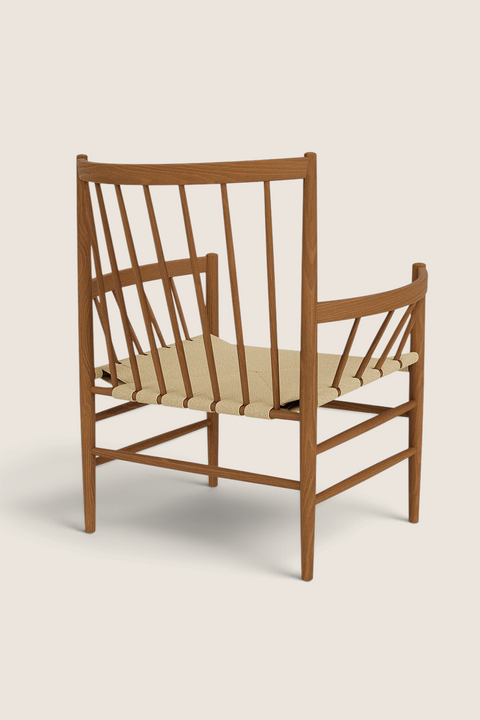 Bolina J82 lounge chair in smoked oiled oak with a woven papercord seat, viewed from the back.