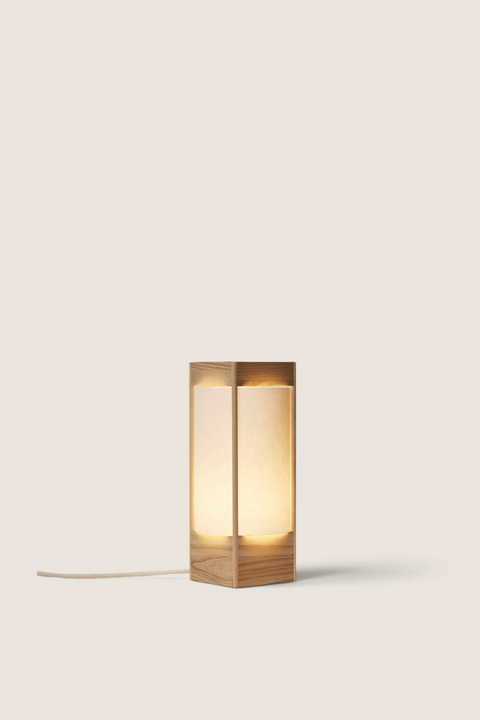Bolina Andon table lamp in light ash wood with a minimalist, sculptural design and warm, soft glowing light.